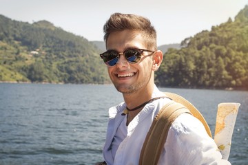 Fototapeta premium traveler with backpack and map