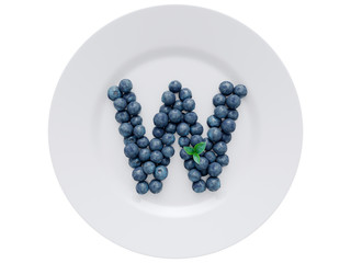 Blueberry font isolated on white ceramic dish. Letter W