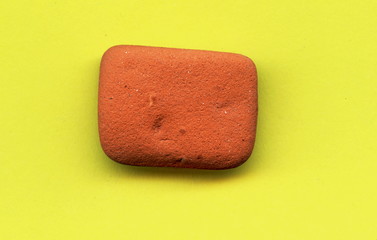 Water-smoothed piece of brick