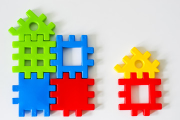 Fototapeta premium Colorful puzzle made from toys wait for fulfillment. Concept for complete or dream life