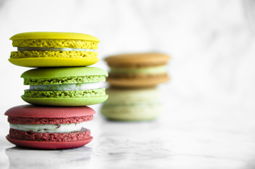 Colorful French macaroons on a marble table