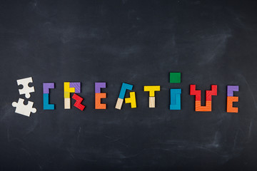Business creative solution concept jigsaw on the blackboard