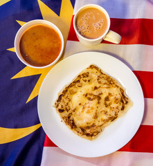 Malaysia Food - roti canai and teh tarik, very famous drink and food on Malaysia Flag.