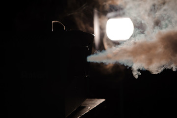 lights in smoke, studio lights shining through the smoke from smoke machine.