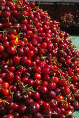 New harvest of fresh ripe red sweet cherry, street market in Italy