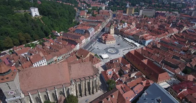 Brasov Romania aerial video footage of the Black Church and main city Square Piata Sfatului