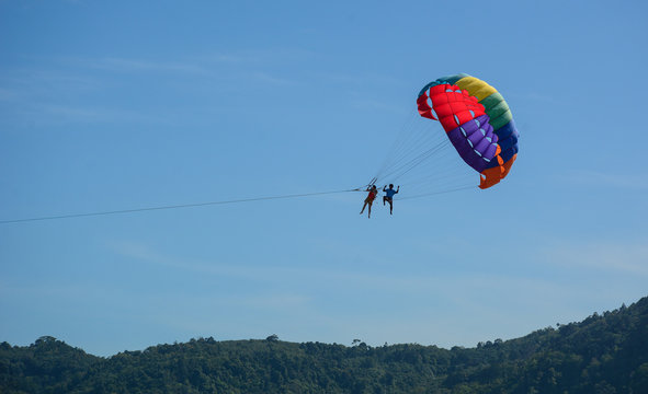 People playing parasailing in Phuket, Thailand