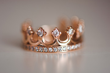 Crown ring with precious stones
