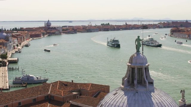 Marine cityscape picturing channel with historical buildings on banks, Venice