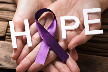 Hand Showing Ribbon With Hope Text