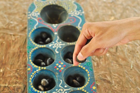 congkak or congklak, Traditional game with lots of holes and using seeds