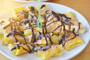 Roti fried with banana topped chocolate