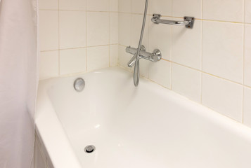 Bathtub in a tiled bathroom