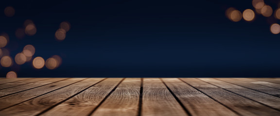 Dark blue bokeh background with wooden stage