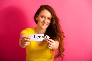 beautiful Woman tearing apart can't text over vibrant pink background