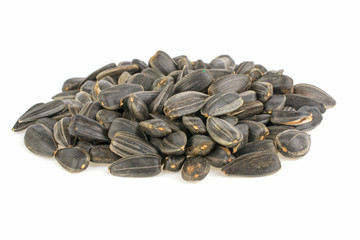 Fried sunflower seeds on white background