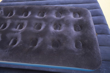 Blue inflatable mattress for sleeping and resting