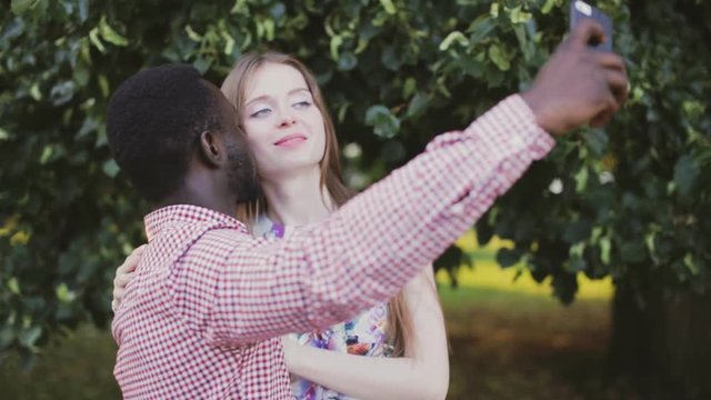 interracial couple take selfie