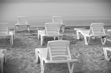 Sunbeds on the seaside. Black and white photos