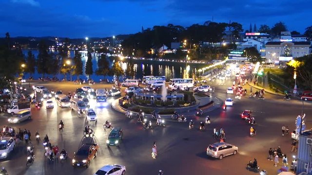 Da Lat city - July 12 2017: A lot of unidentified people drive by motorcycles, car, bus, truck and walking in Da Lat center market. This place is the most popular shopping in Da Lat, Lam Dong, Vietnam