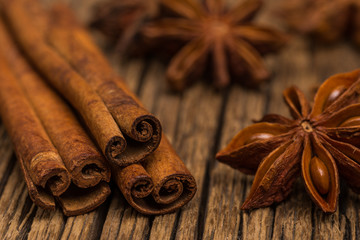 Star anise and cinnamon on old wooden table.