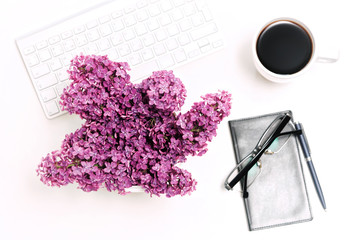 Workplace computer keyboard mobile phone coffee notebook glasses lilac