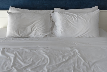 white pillows on bed