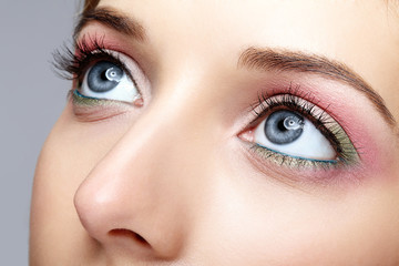 Closeup macro shot of human woman face with  eyes day makeup