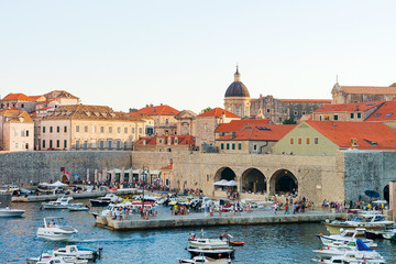 People at Old port and Dubrovnik Cathedral