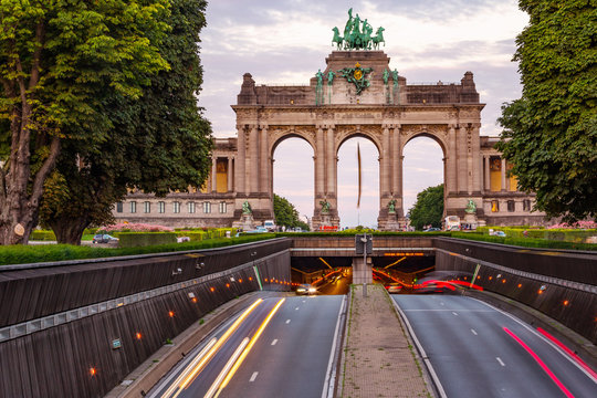 Dramatic view of the Triumphal Arch and Belliard Tunnel in Park Cinquantenaire in Brussels during sunset