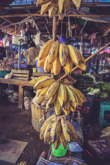 Bunch of ripe bananas hanging for sale in the local market