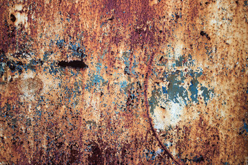 Old metal, rusty iron with a multicolored faded paint