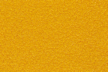 Yellow surface of foam material with a heat-insulating property.