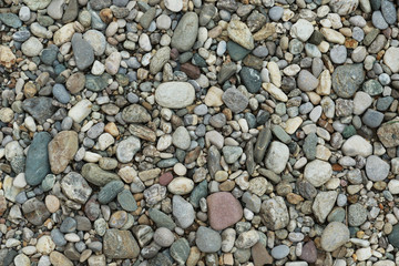 Graue Natur Kiesfläche mit verschiedenen Steinen