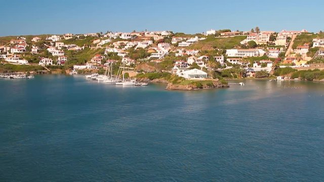 City on coast of sea gulf. Mahon, Minorca, Spain