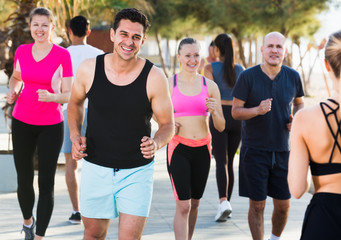 Fototapeta na wymiar Active people during running training