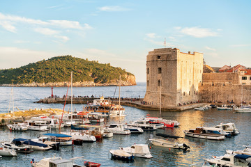 Fototapeta na wymiar St John Fort and Sailing boats at Old port Dubrovnik