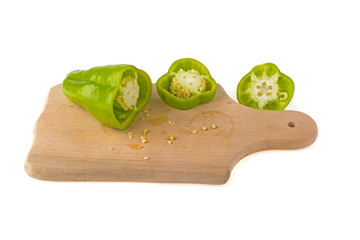 Sliced slice of green pepper on white background