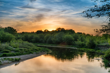 Fototapeta na wymiar Sunset over river