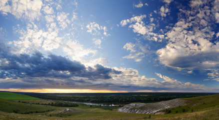 Fototapeta na wymiar Panoramic view from the hills from the chalk to the valley of the Don River. Photographed in Russia before sunset.