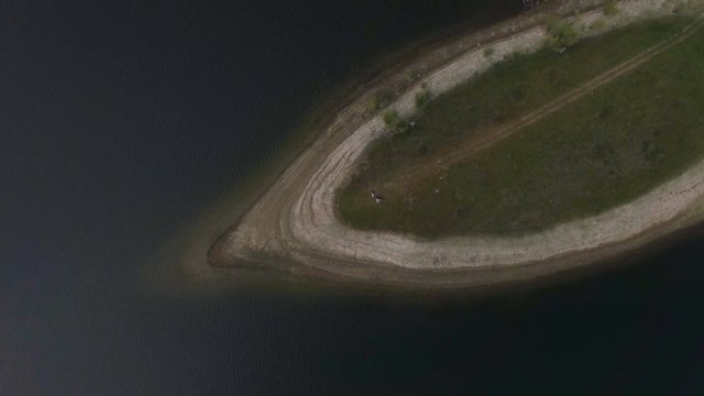 Aerial view. Two musicians Pianist and accordionist playing on the island