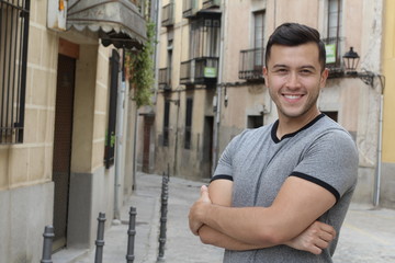 Young Hispanic male smiling outside 