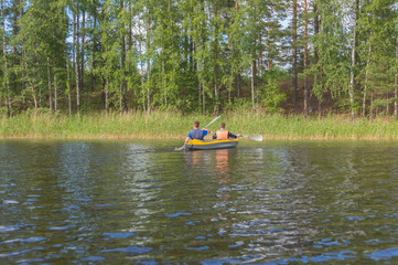 friends in the campaign on floating kayaks.