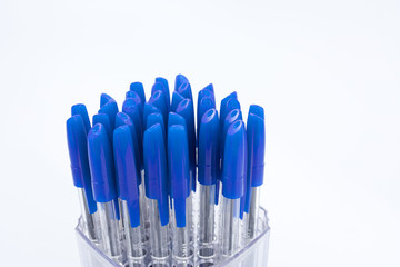 Fototapeta premium A lot of ballpoint pens on a white background.