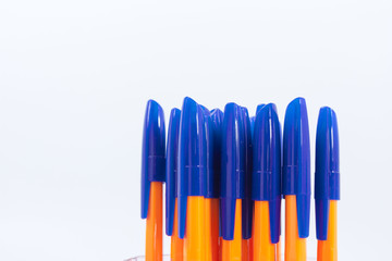 A lot of ballpoint pens on a white background.