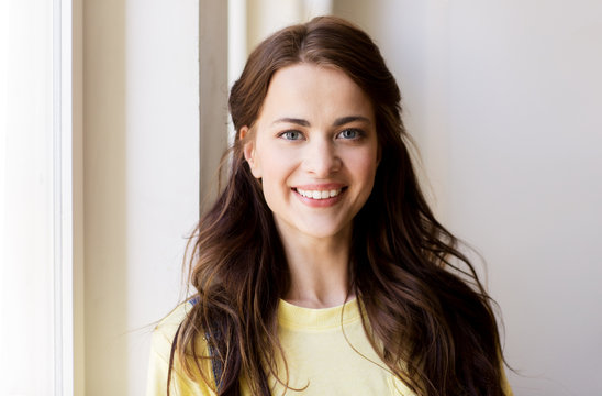 portrait of smiling young woman or teenage girl