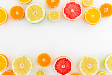 Citrus fruits pattern of lemon, orange and grapefruit on white background. Flat lay, top view.