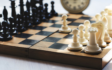 White and black pieces on chess board