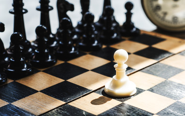 White and black pieces on chess board