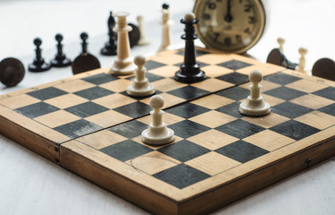 White and black pieces on chess board